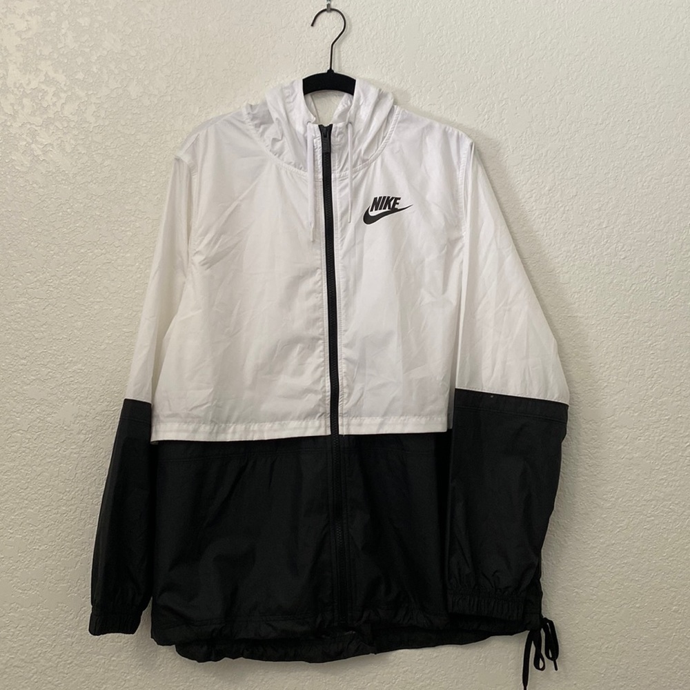 Nike jacket; half white, half black with a draw string at the bottom to tighten